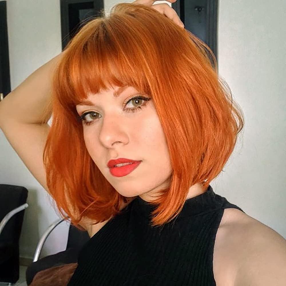 imageColorfulpanda Courte Perruque Femme Orange 14 Pouces Synthtique Perruque Bob avec Frange Naturelle Perruques pour Femme Cosplay Wig with BangsAuburn Rouge Couleurauburn